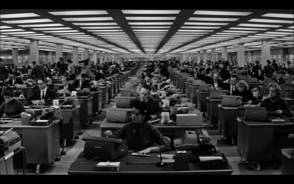 Fig. 1.2. The office in The Apartment. Although the layout is similar to its counterpart in Double Indemnity, the office radically increases in size in the later film. In fact, Wilder strove to make The Apartment's office appear infinitely large. In Some Like it Wilder, Gene D. Phillips quotes Wilder explaining his use of forced perspective in this scene: 