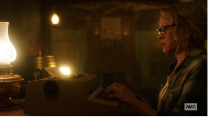 Connie typing on a typewriter at Lodge 49.